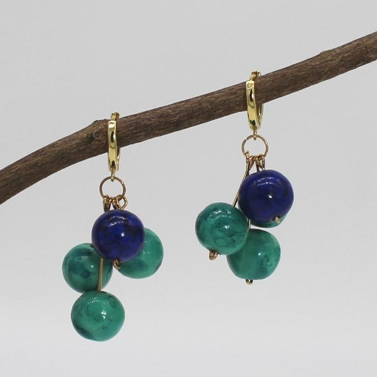 Green and Cobalt Blue glossy ceramic finish Drops delicatedly mounted on golden studs and  huggie hoop.